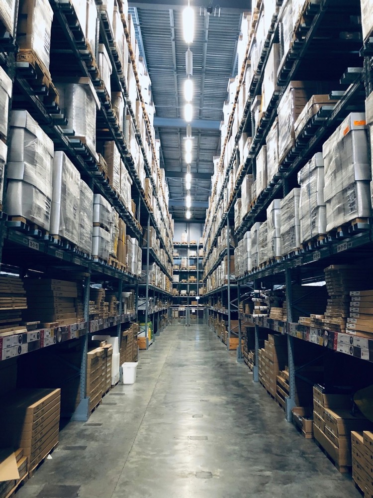 Warehouse aisles stacked with pallets